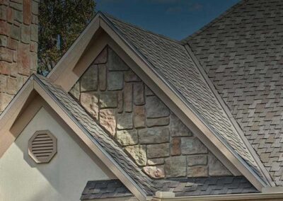 pointed roof with stone accent